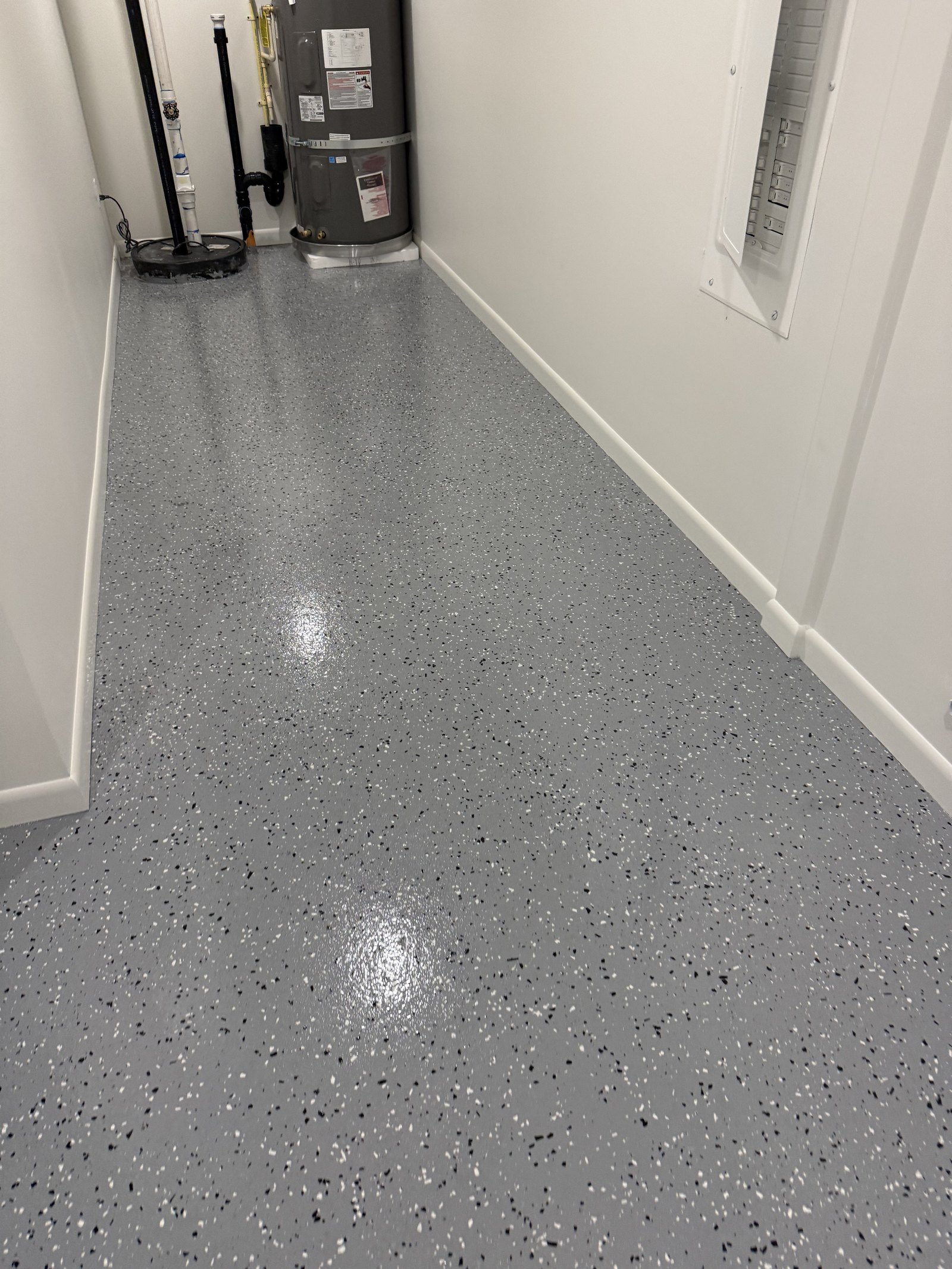 Completed gray flake floor coating in a utility and mechanical room